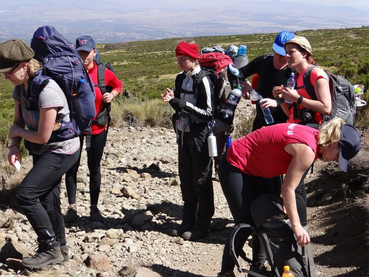 Trekker drinking water at high altitude